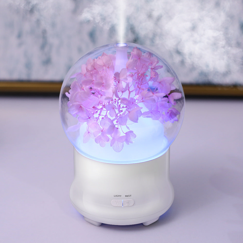 Diffuseur fleur lumineuse modèle rose, globe transparent éclairé en rose